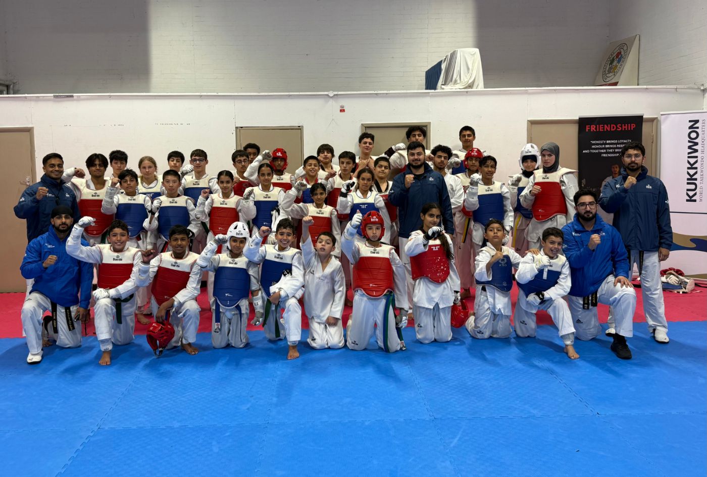 Panthers squad in sparring kit at the Kukkiwon hall